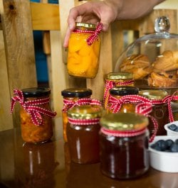 shop-assistant-arranging-jam-pickle-jars.jpg