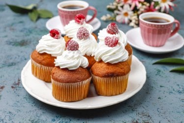 cupcakes-decorated-whipped-cream-frozen-raspberries (Medium).jpg