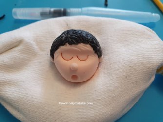 Model Head in Cradle by Help Me Bake.jpg